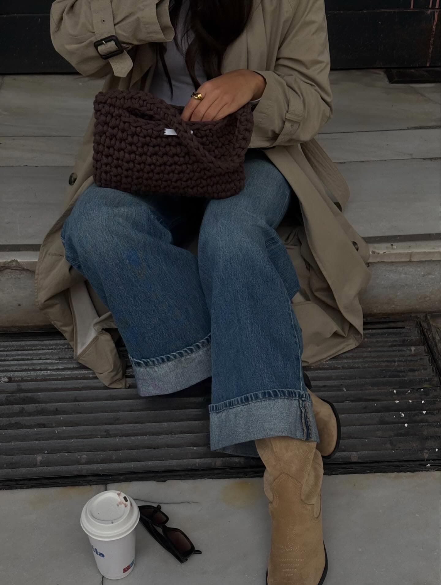 Cocoa crochet bag styled with denim and a trench coat
